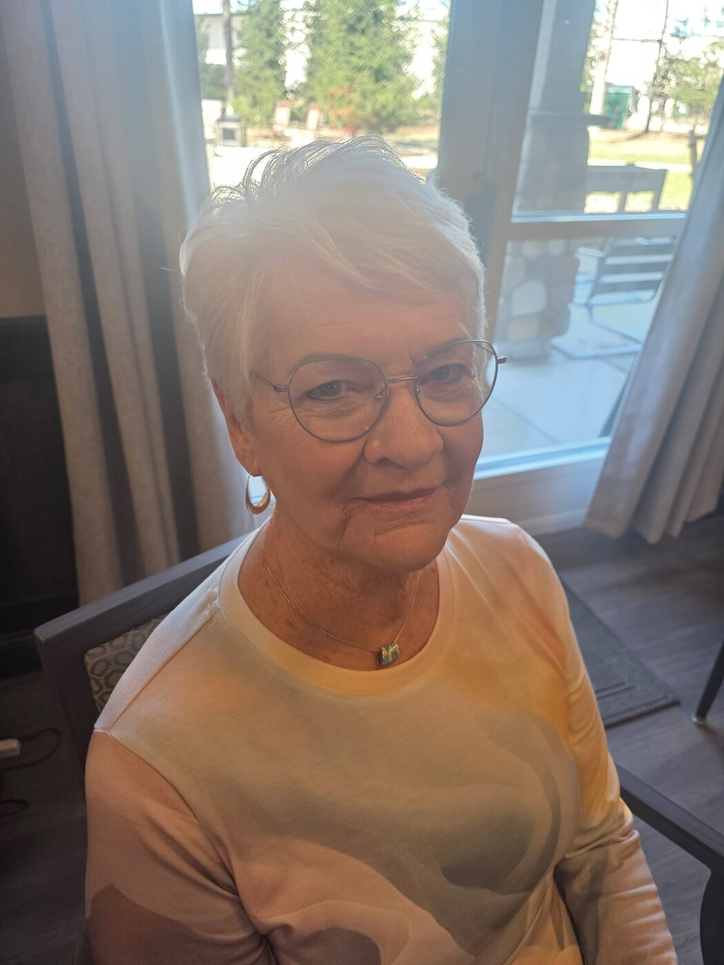 A happy client showing off her style