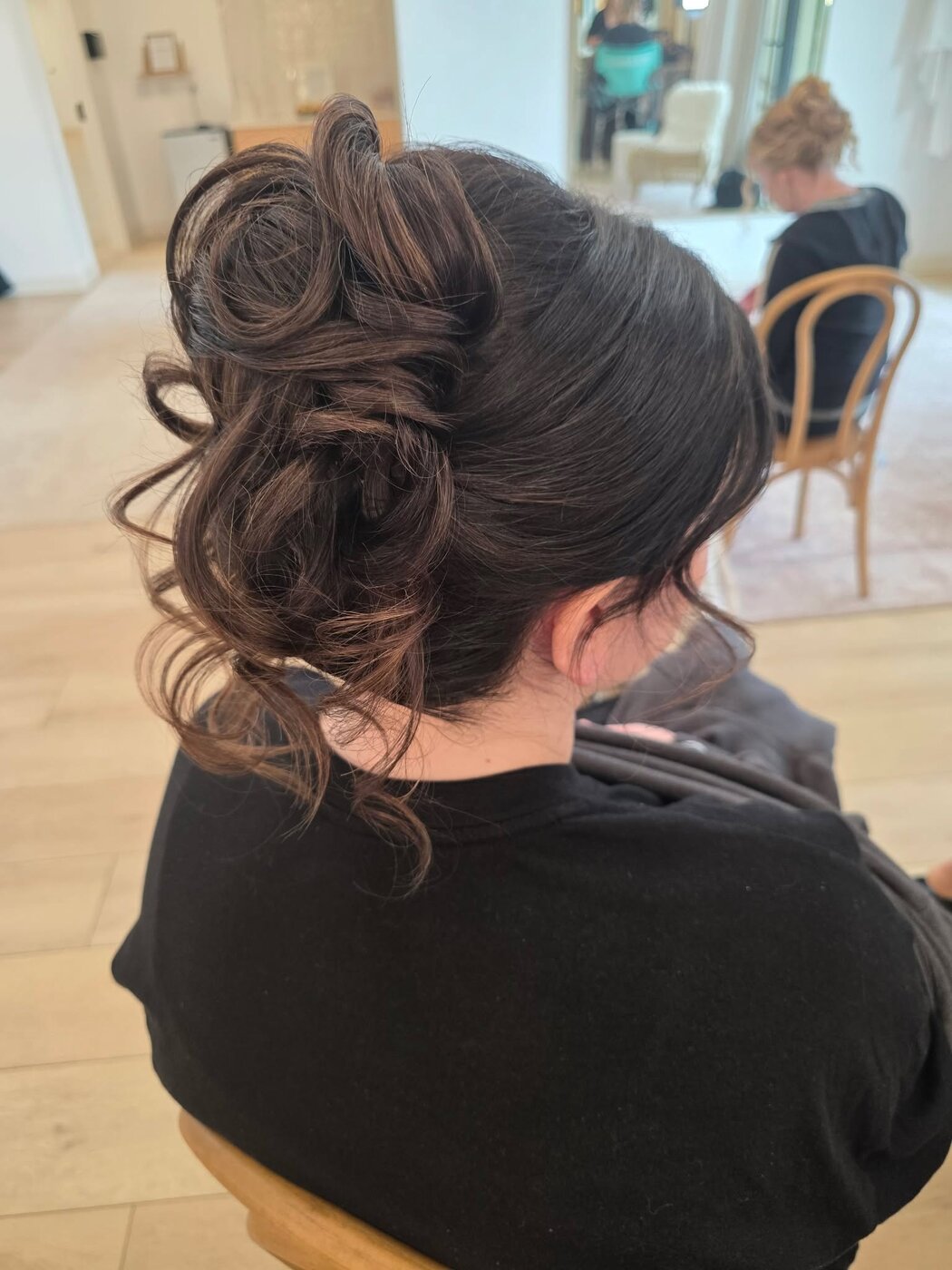 Elegant bridal updo with soft romantic curls